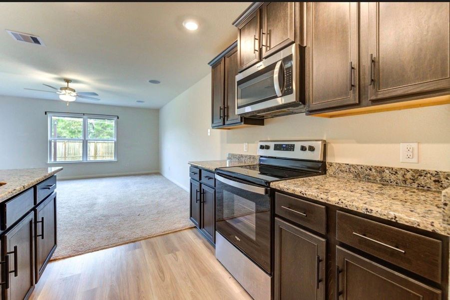 Furnished interior view inside a new home in Williams Trace, Magnolia (Image 5).