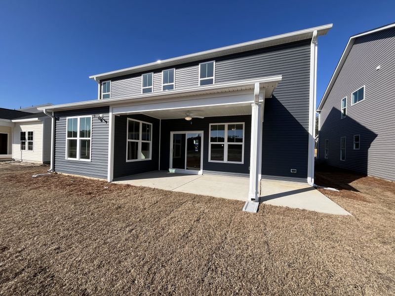 Exterior details and patio area of a home in River Tide Farms, Bolivia (Image 21).