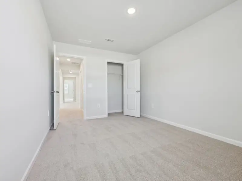 Spacious, unfurnished interior of a new home in The Rows at Buffaloe Reserve, Raleigh (Image 18). Spacious, unfurnished interior of a new home in The Rows at Buffaloe Reserve, Raleigh (Image 18).