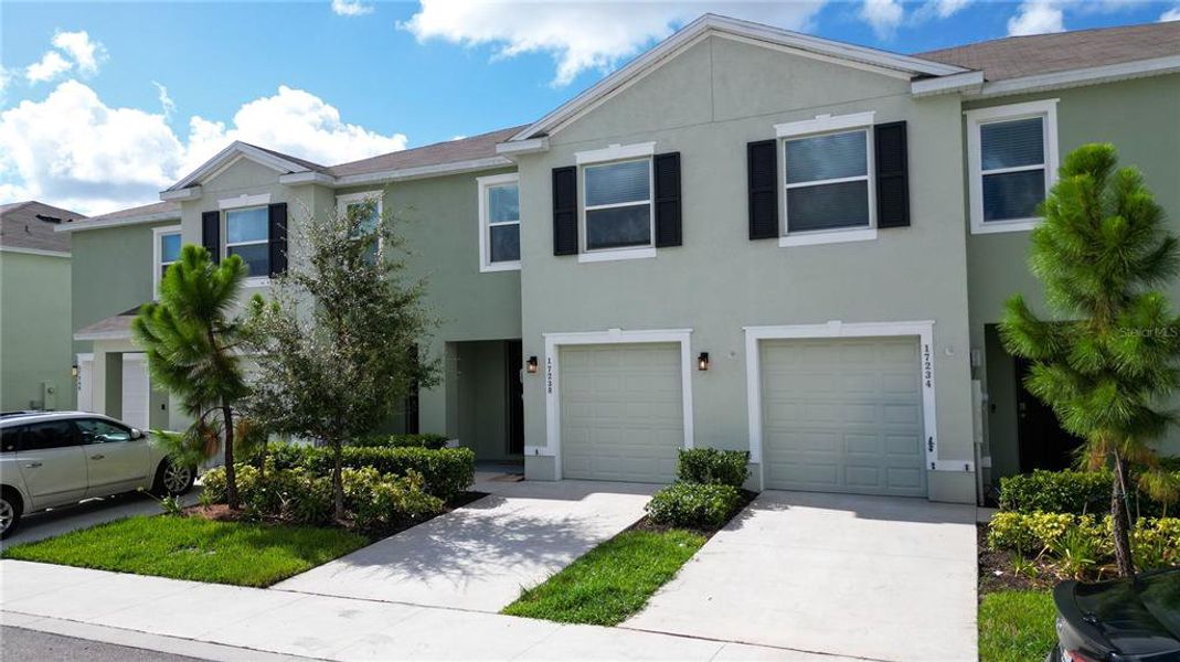 Front exterior of a new home in , Land O' Lakes, FL, highlighting curb appeal (Image 2). Front exterior of a new home in , Land O' Lakes, FL, highlighting curb appeal (Image 2).