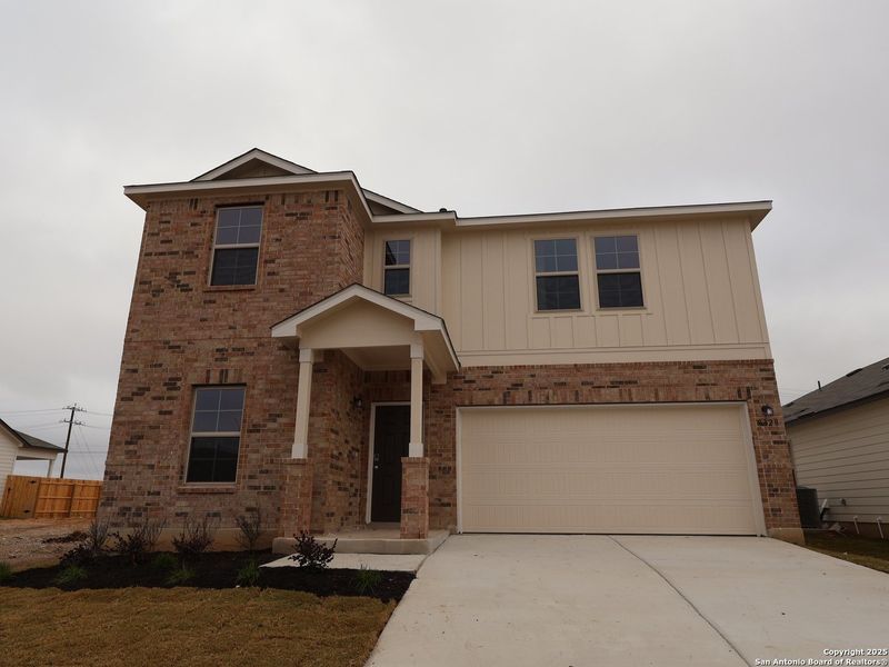 Front exterior of a new home in Agave, San Antonio, TX, highlighting curb appeal (Image 21).