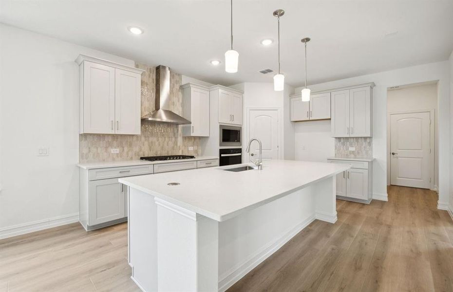 Kitchen featuring a large island ideal for informal dining and gatherings Kitchen featuring a large island ideal for informal dining and gatherings