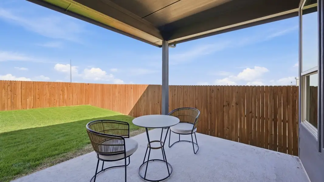 Exterior details and patio area of a home in Bluestem, Rhome (Image 2).