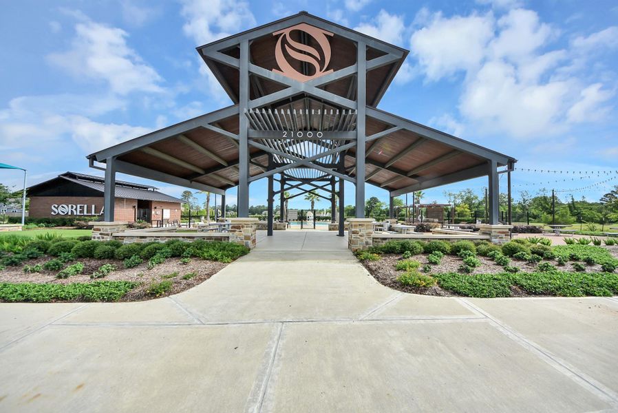 Beautiful community pavilion with landscaped walkways and open gathering space.