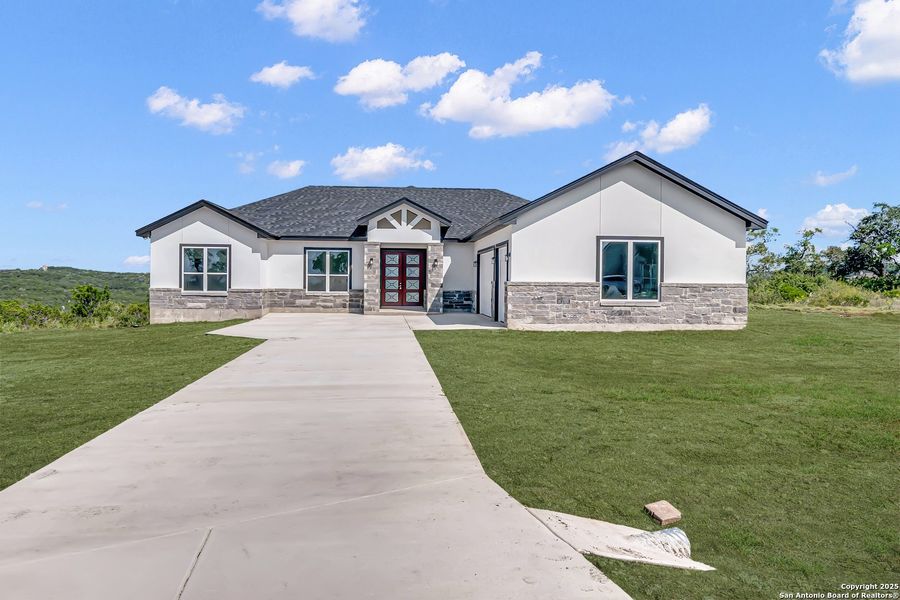 Front exterior of a new home in , Mico, TX, highlighting curb appeal (Image 20). Front exterior of a new home in , Mico, TX, highlighting curb appeal (Image 20).