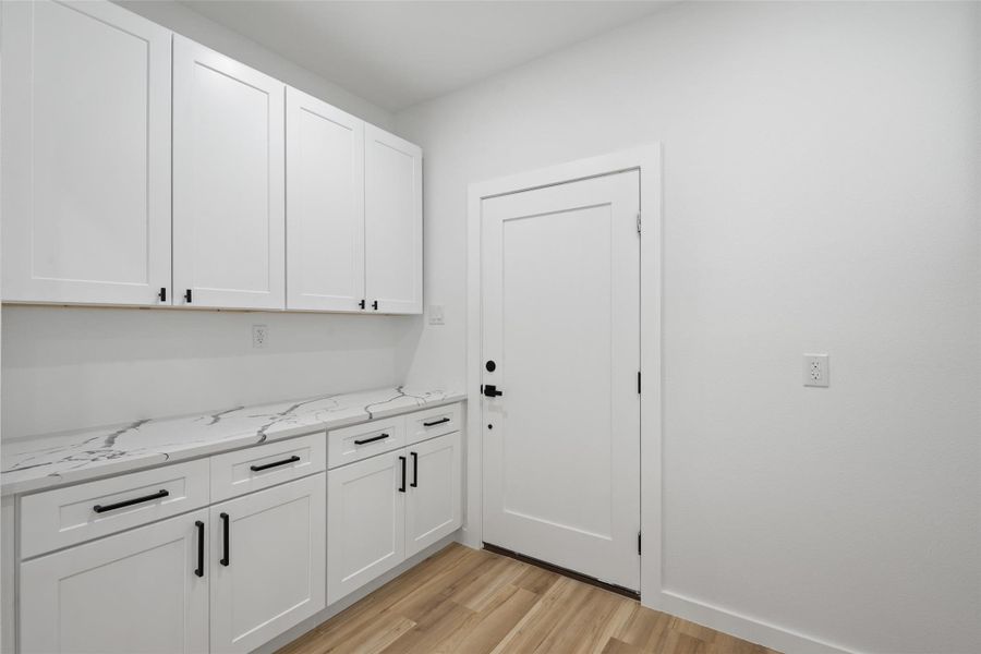 Laundry area featuring light wood-type flooring Laundry area featuring light wood-type flooring