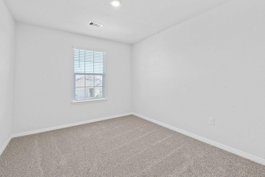Empty room with baseboards and carpet flooring Empty room with baseboards and carpet flooring