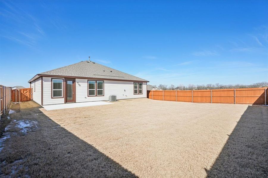 Exterior details and patio area of a home in Heartland Signature, Crandall (Image 3).
