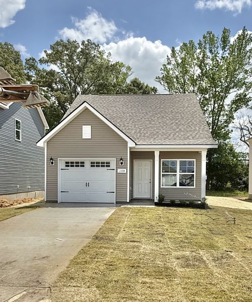 Front exterior of a new home in Stonehenge, Manchester, TN, highlighting curb appeal (Image 1). Front exterior of a new home in Stonehenge, Manchester, TN, highlighting curb appeal (Image 1).