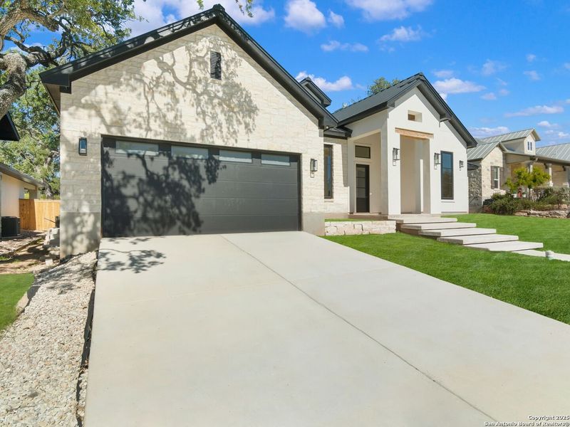 Front exterior of a new home in , Boerne, TX, highlighting curb appeal (Image 27).