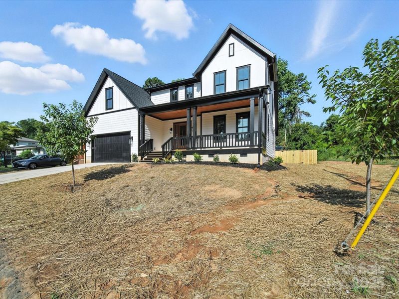 Front exterior of a new home in , Charlotte, NC, highlighting curb appeal (Image 24).