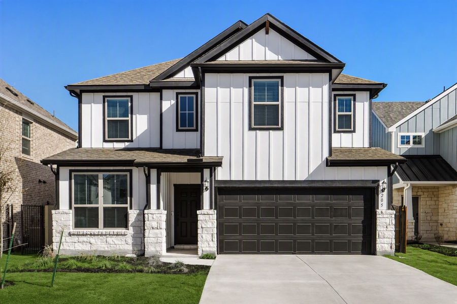 Front exterior of a new home in Santa Rita Ranch, Liberty Hill, TX, highlighting curb appeal (Image 21). Front exterior of a new home in Santa Rita Ranch, Liberty Hill, TX, highlighting curb appeal (Image 21).