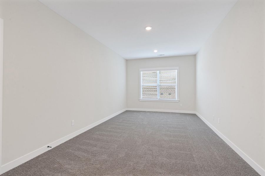 Unfurnished room featuring carpet floors and baseboards Unfurnished room featuring carpet floors and baseboards