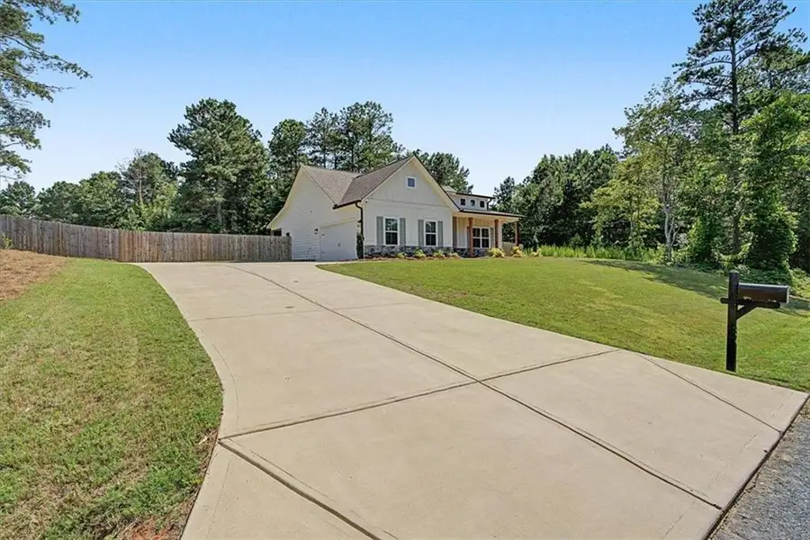 Front exterior of a new home in , Dallas, GA, highlighting curb appeal (Image 24).