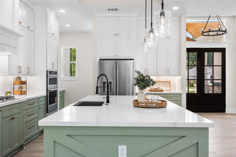There's Beautiful Calalcatta Gold-Look Quartz Counters Throughout this Home, Offering Attention to Detailing in the Custom Cabinetry Work.