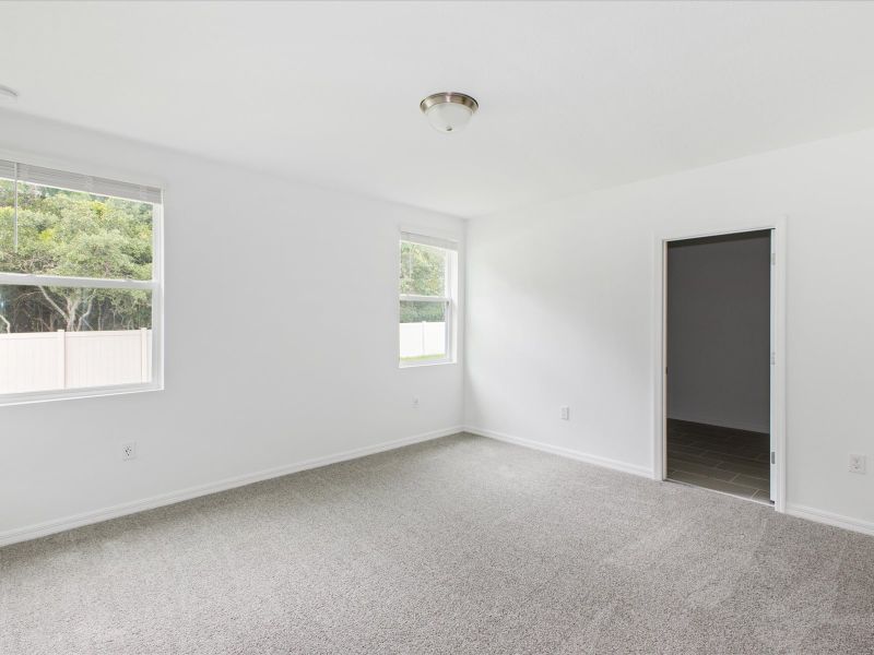 Primary bedroom in the Daphne floorplan at 2386 White Tail Street