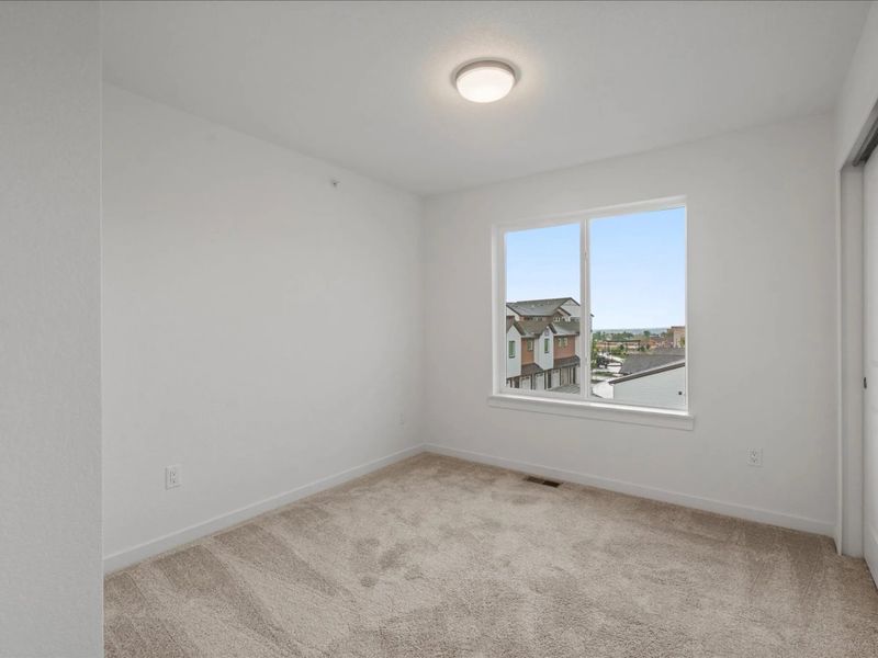 Spacious, unfurnished interior of a new home in The Commons at Victory Ridge, Colorado Springs (Image 8).