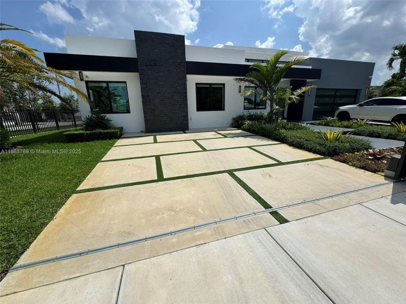 Front exterior of a new home in , Miami, FL, highlighting curb appeal (Image 27).
