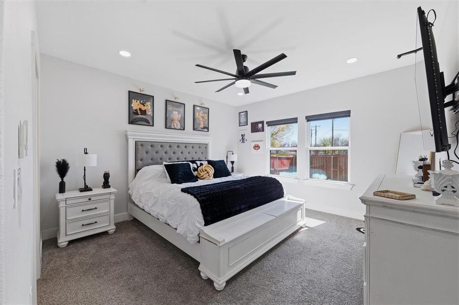 Bedroom featuring carpet flooring, ceiling fan, and recessed lighting