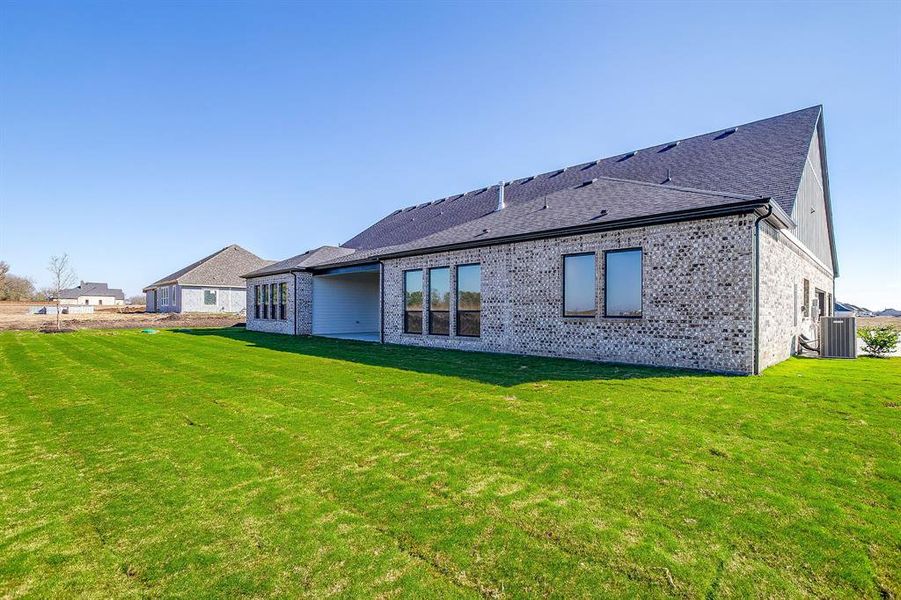Exterior details and patio area of a home in Waterfall Ranch, Waxahachie (Image 3).