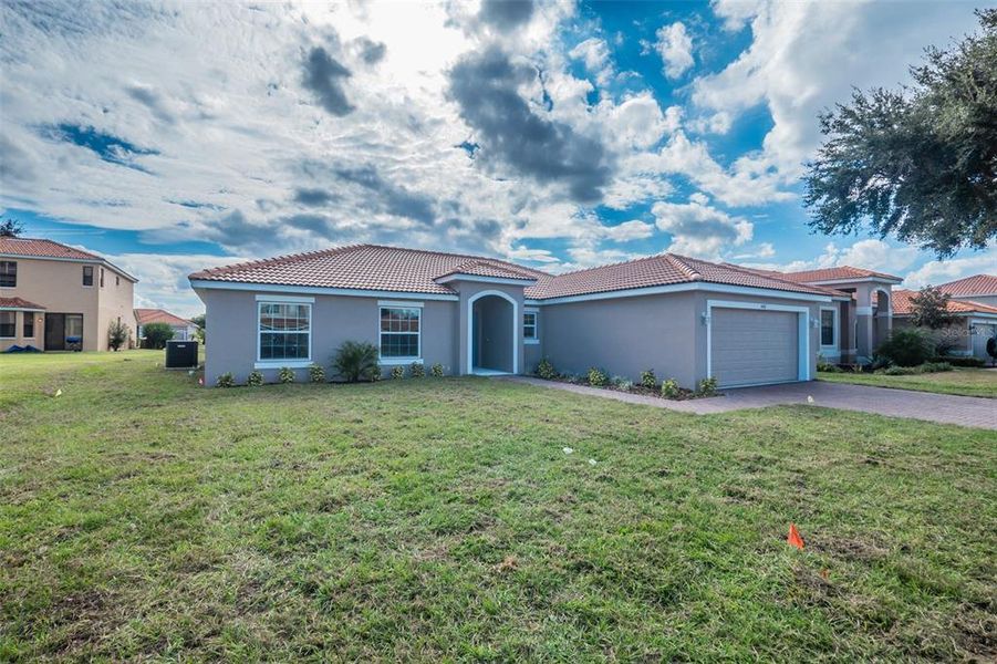 Front exterior of a new home in , Kissimmee, FL, highlighting curb appeal (Image 20).