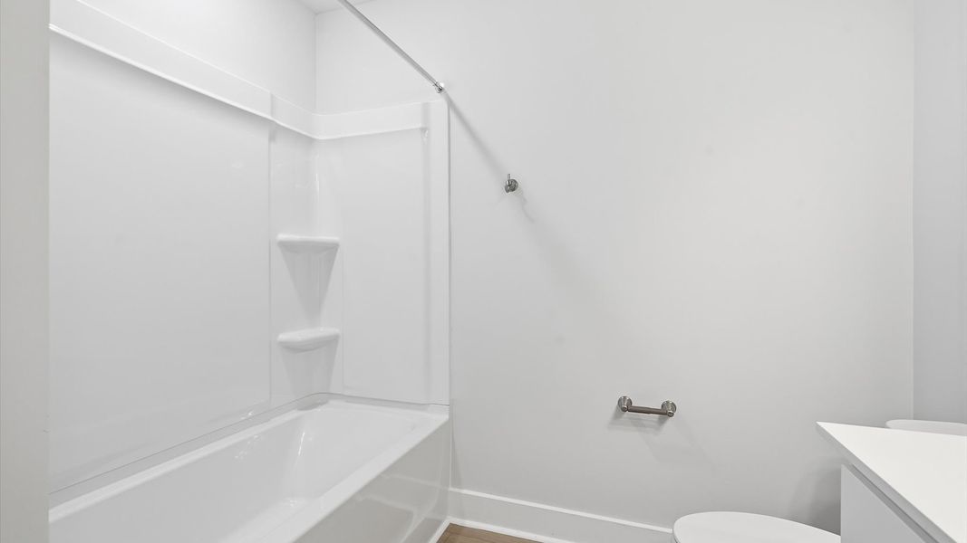 Top-notch bathroom with current fixtures, tasteful materials, and elevated charm