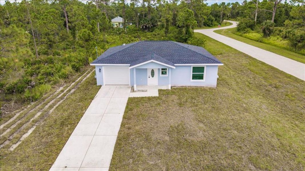Front exterior of a new home in , Punta Gorda, FL, highlighting curb appeal (Image 2).