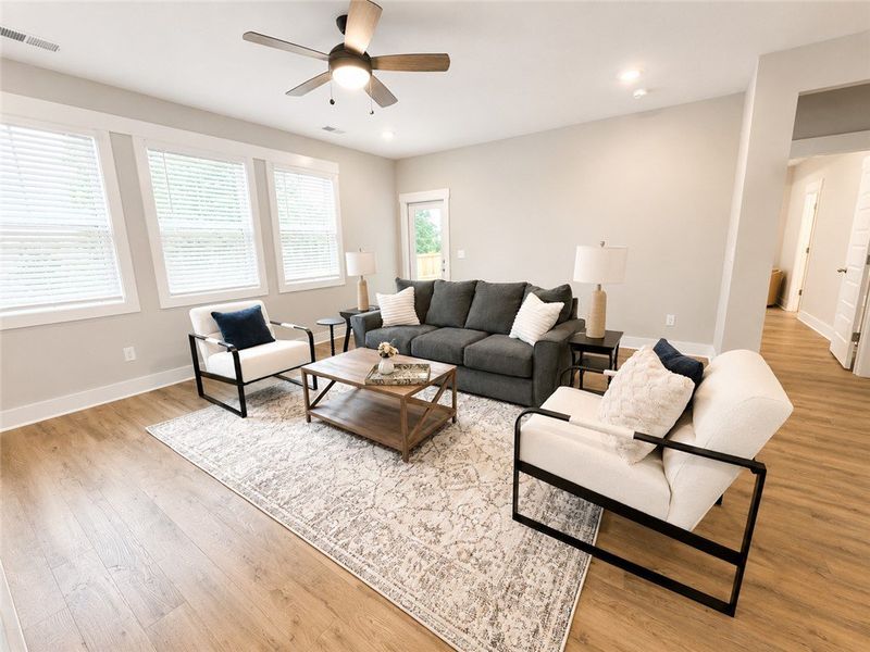 Natural light floods this inviting living space, c Natural light floods this inviting living space, c