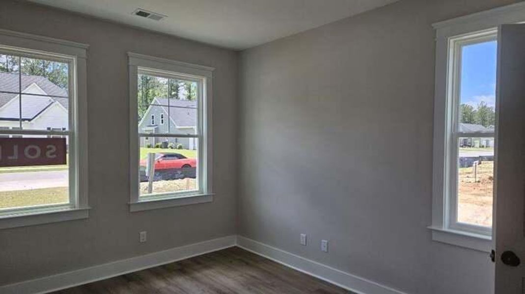 Spacious, unfurnished interior of a new home in The Enclave at French Quarter Creek, Huger (Image 10).