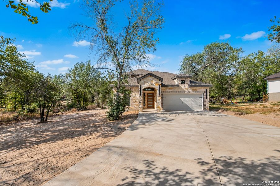 Front exterior of a new home in , San Antonio, TX, highlighting curb appeal (Image 18). Front exterior of a new home in , San Antonio, TX, highlighting curb appeal (Image 18).