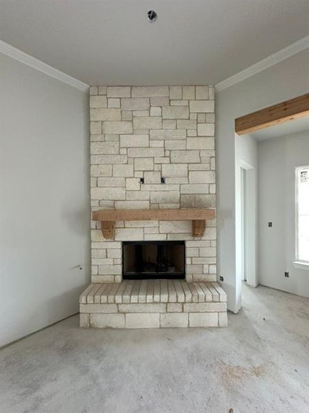 Detailed view of a stone fireplace and ornamental molding