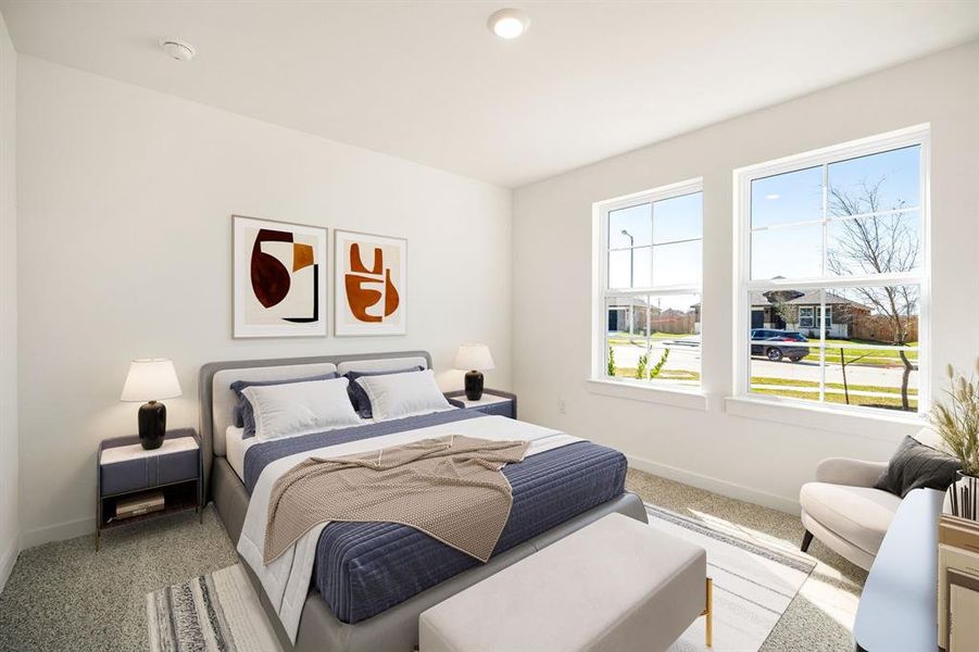 Secondary bedroom features plush carpet, lighting and a large window.