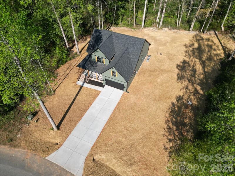 Front exterior of a new home in , Statesville, NC, highlighting curb appeal (Image 24).