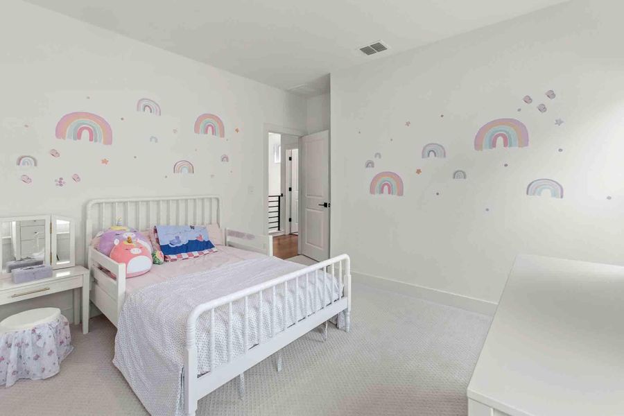 Carpeted room with light-colored walls and baseboards