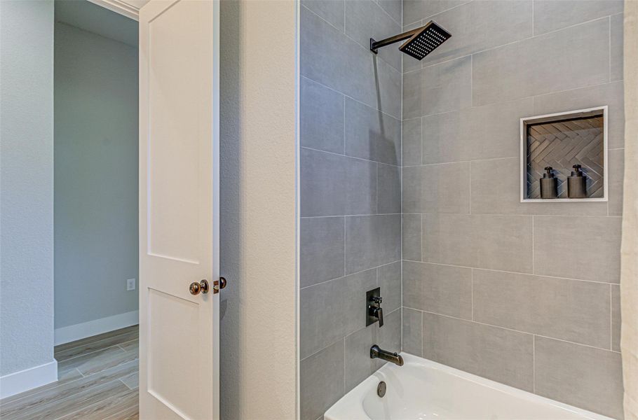 Bathroom featuring shower / bathtub combination.