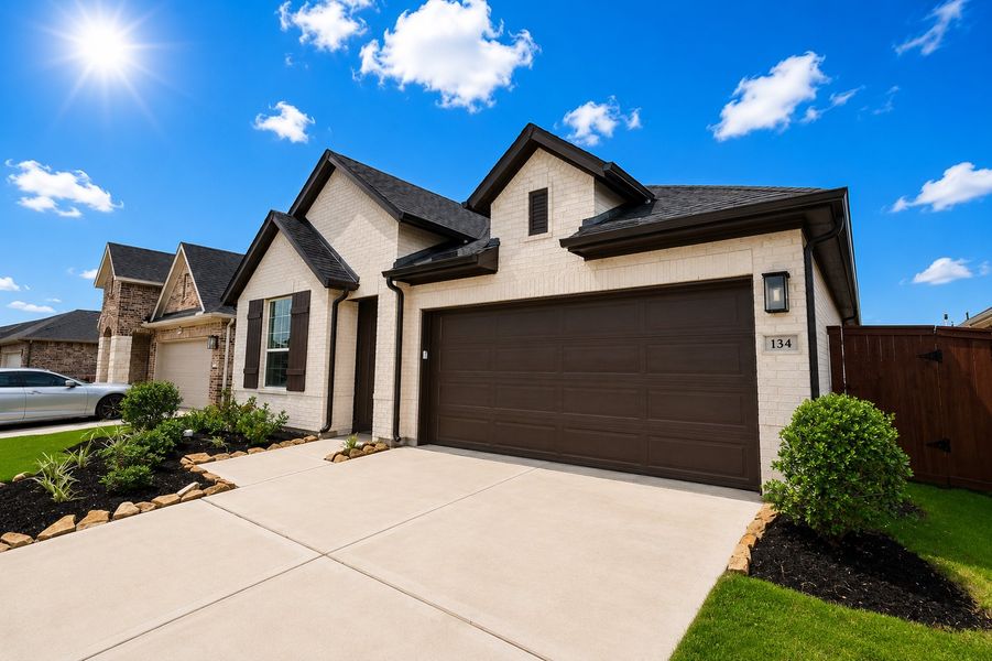 Front exterior of a new home in Brookewater - Terrace Collection, Rosenberg, TX, highlighting curb appeal (Image 2). Front exterior of a new home in Brookewater - Terrace Collection, Rosenberg, TX, highlighting curb appeal (Image 2).