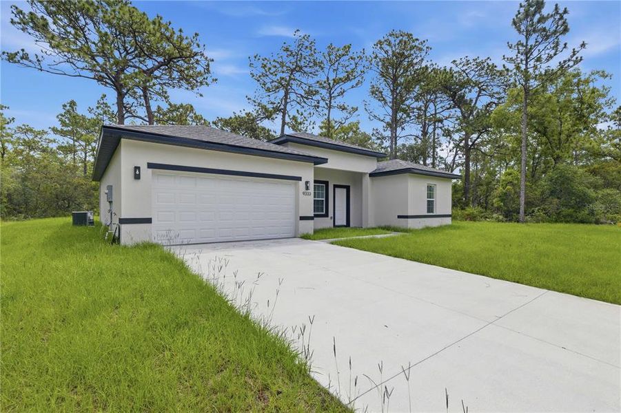 Front exterior of a new home in , Citrus Springs, FL, highlighting curb appeal (Image 2). Front exterior of a new home in , Citrus Springs, FL, highlighting curb appeal (Image 2).