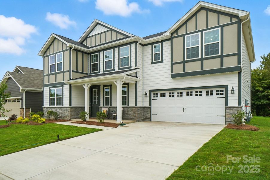 Front exterior of a new home in Waxhaw Landing, Monroe, NC, highlighting curb appeal (Image 1).