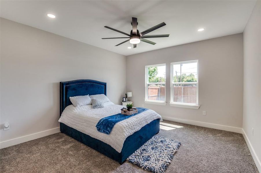 Bedroom with carpet floors and ceiling fan