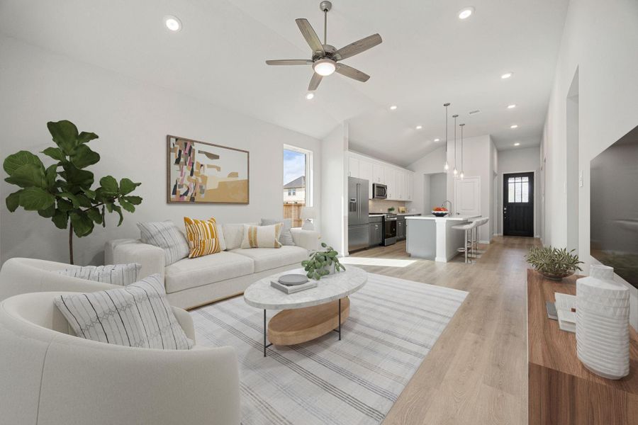 This image showcases the seamless flow of the main living area, featuring an open concept layout where the living room, kitchen, and hallway connect fluidly. The vantage point offers a clear view down to the front door, emphasizing the home's spacious and inviting atmosphere. This image showcases the seamless flow of the main living area, featuring an open concept layout where the living room, kitchen, and hallway connect fluidly. The vantage point offers a clear view down to the front door, emphasizing the home's spacious and inviting atmosphere.