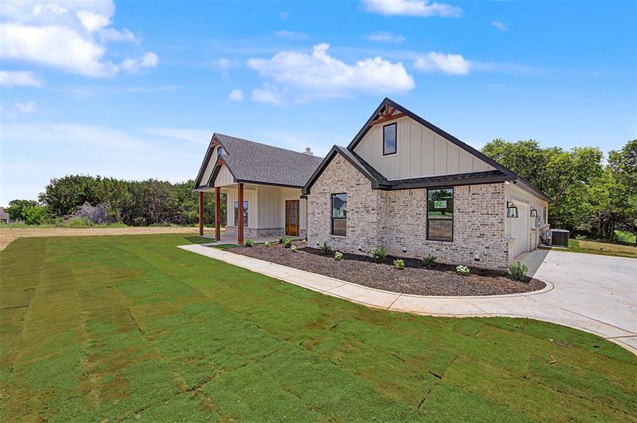 Front exterior of a new home in , Rio Vista, TX, highlighting curb appeal (Image 23). Front exterior of a new home in , Rio Vista, TX, highlighting curb appeal (Image 23).
