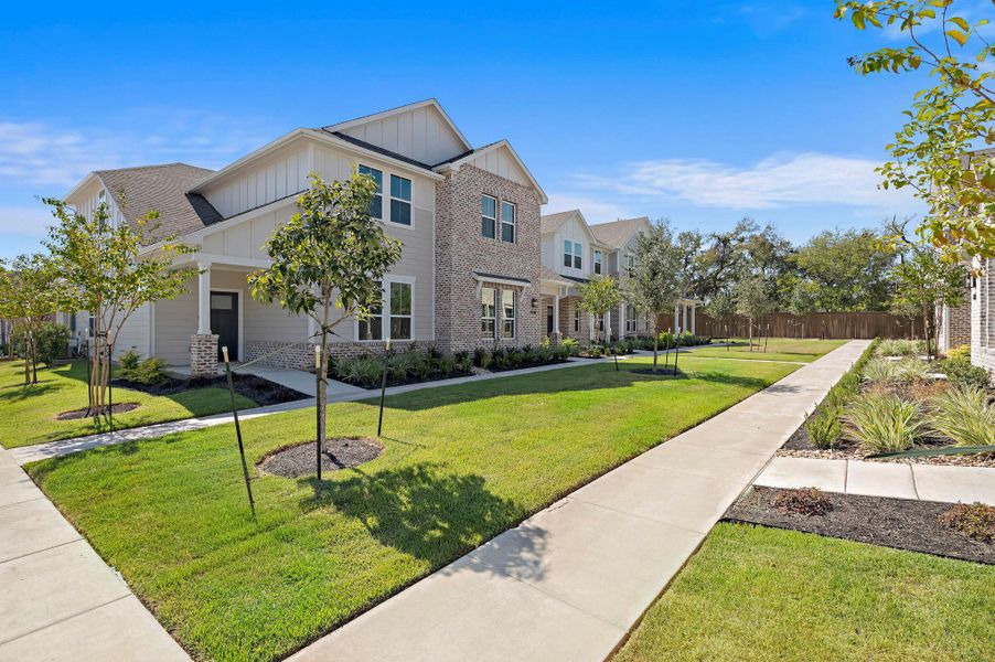 Front exterior of a new home in , Buda, TX, highlighting curb appeal (Image 18).