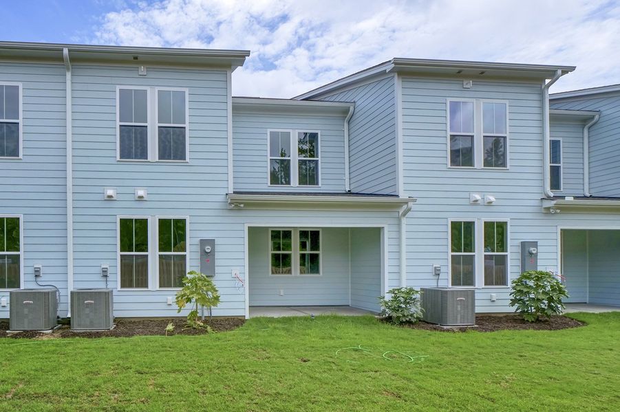 Front exterior of a new home in Grand Park, Leland, NC, highlighting curb appeal (Image 2). Front exterior of a new home in Grand Park, Leland, NC, highlighting curb appeal (Image 2).