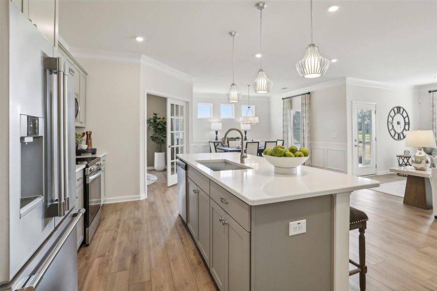 The Avondale- Kitchen into Study and Dining Room. Sample image for illustration; upgrades, options, and colors may vary.