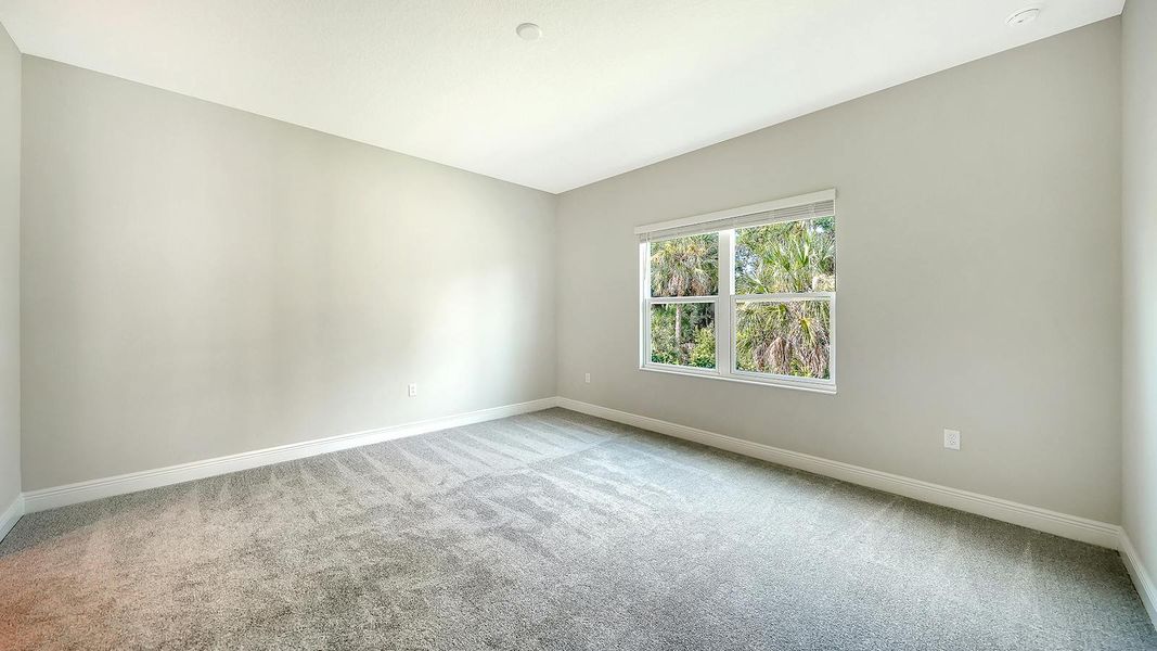 Spacious, unfurnished interior of a new home in Wildleaf Real Estate and Homes for Sale in Parrish, FL - Neal Communities, Parrish (Image 29).