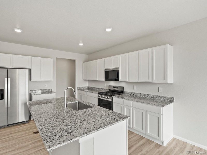 Furnished interior view inside a new home in Poudre Heights: The Lakes Collection, Windsor (Image 9).