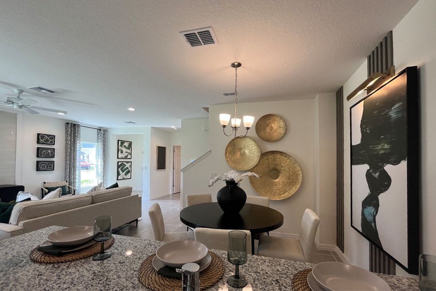 Ashley townhome model in Pine Meadows, Eustis FL — elegant two-story home with 4 bedrooms, 3 baths, and 1,898 sq. ft. of living space. Featuring an open-concept kitchen, dining, and living area, this modern townhome offers flexible layouts for families, guests, or a home office. Highlights include a spacious primary suite with private bath, second-floor laundry, covered lanai, and welcoming entry porch. Built with energy efficiency and stylish design, the Ashley townhome blends comfort, functionality, and charm in a sought-after Central Florida community.