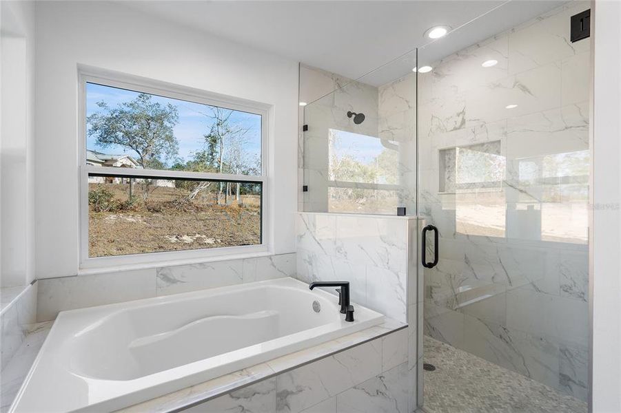 MASTER BATHROOM WITH TUP AND GLASS SHOWER