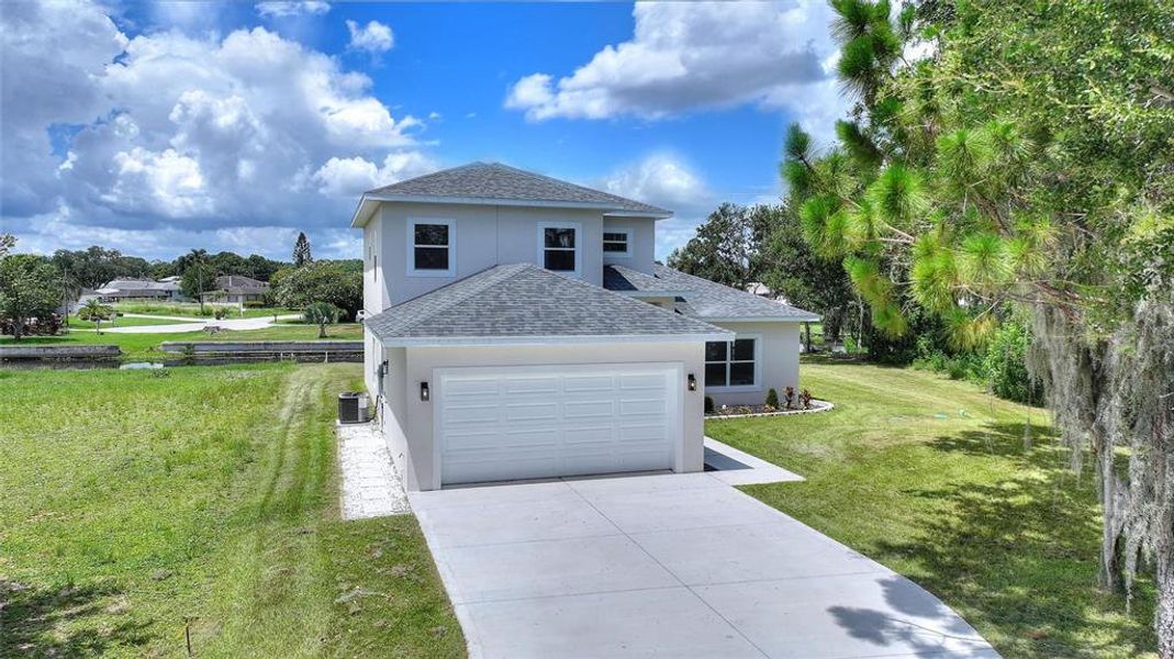 Front exterior of a new home in , Lake Placid, FL, highlighting curb appeal (Image 22). Front exterior of a new home in , Lake Placid, FL, highlighting curb appeal (Image 22).