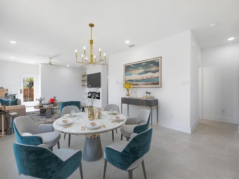 Dining space featuring a ceiling fan, a chandelier, and recessed lighting Virtually Staged